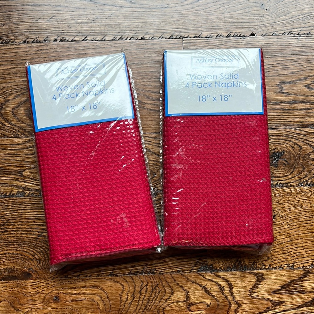 2 sets of 4 woven red cloth napkins, 18 X 18. Still in original packaging.
